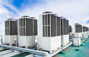 rows-of-rooftop-commercial-HVAC-units-with-blue-sky